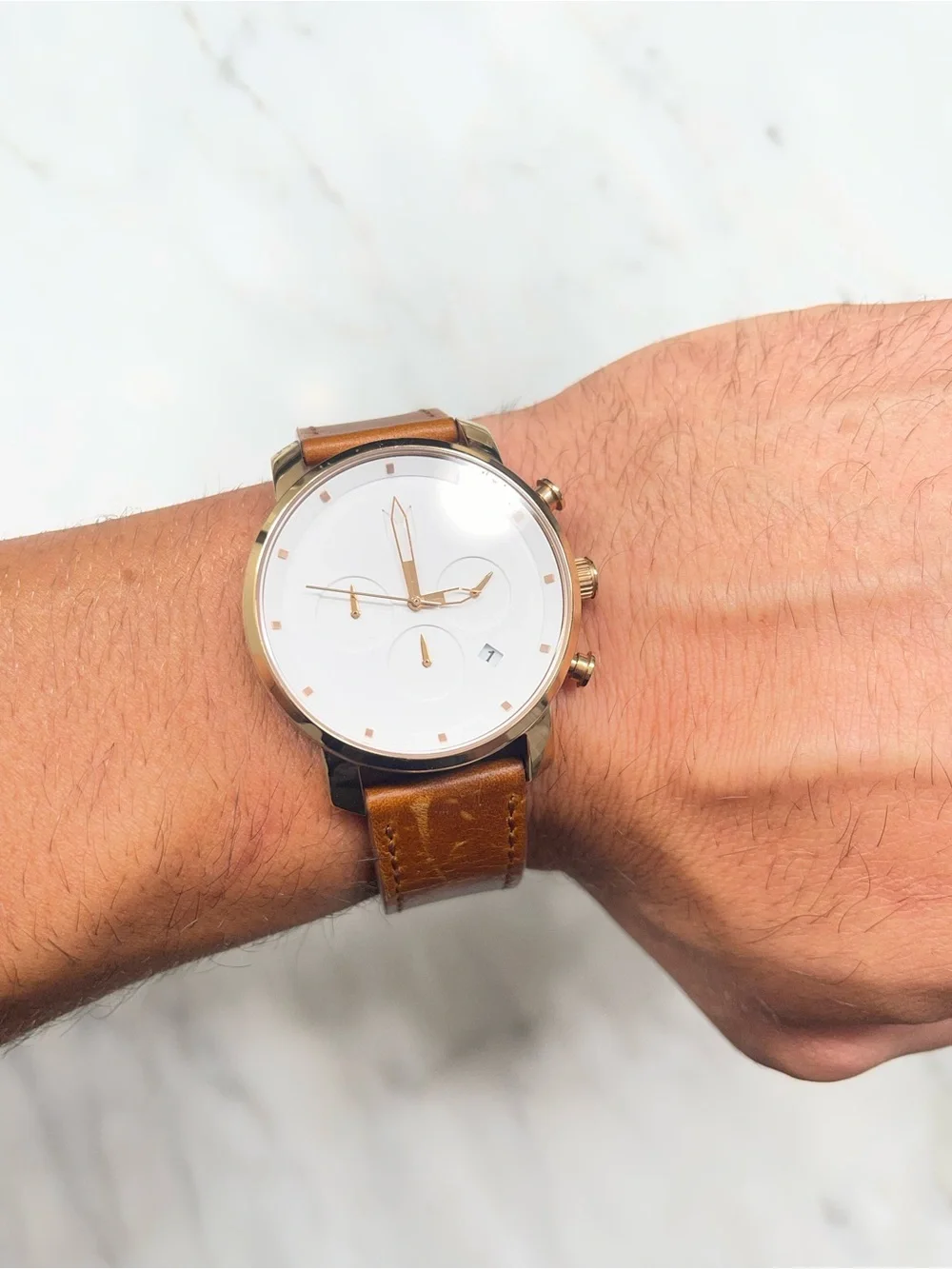 Men’s MVMT chronograph style watch with white dial and brown leather strap